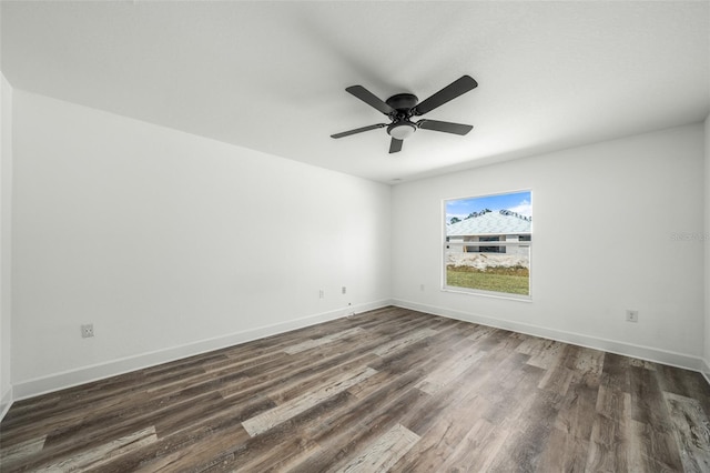 unfurnished room with ceiling fan and dark wood-type flooring