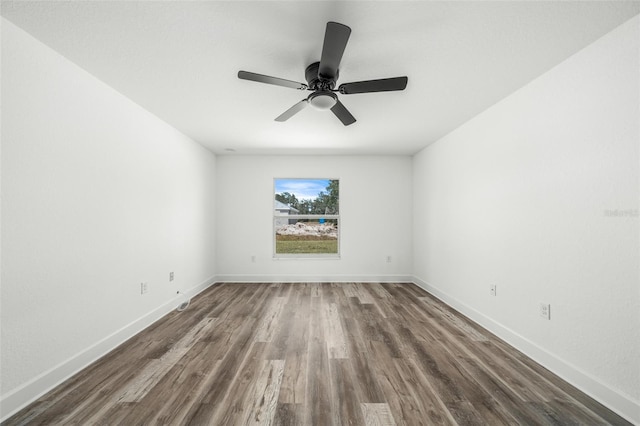 empty room with hardwood / wood-style flooring and ceiling fan