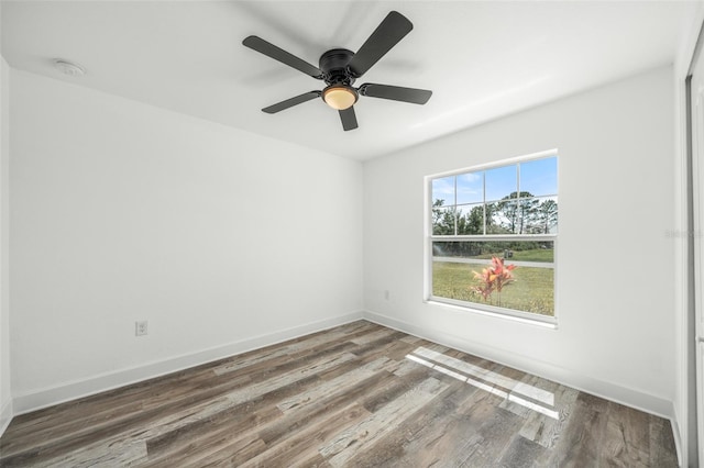 spare room featuring ceiling fan and wood-type flooring