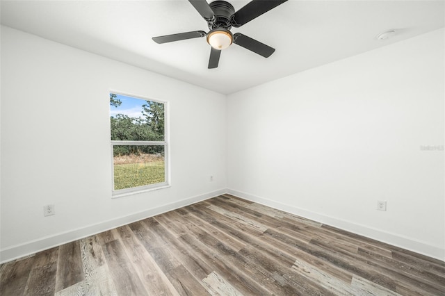 empty room with hardwood / wood-style flooring and ceiling fan