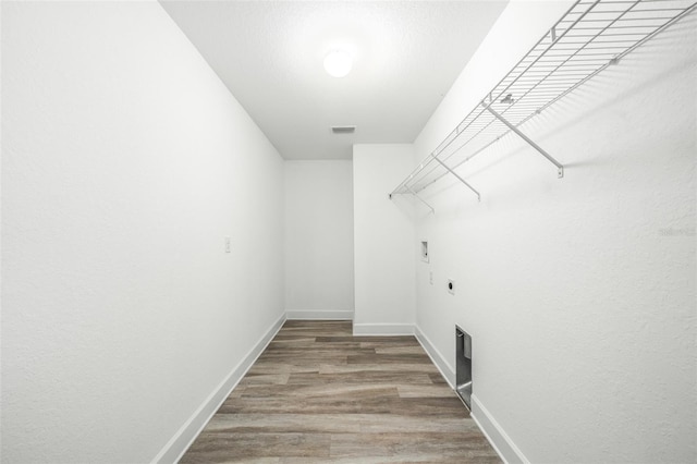 walk in closet featuring hardwood / wood-style flooring