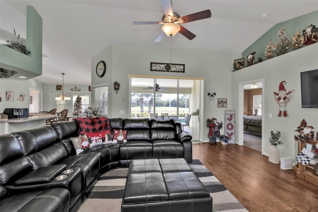 living room featuring ceiling fan, plenty of natural light, high vaulted ceiling, and wood-type flooring