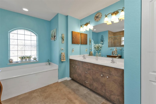 bathroom with tile patterned floors, vanity, and independent shower and bath