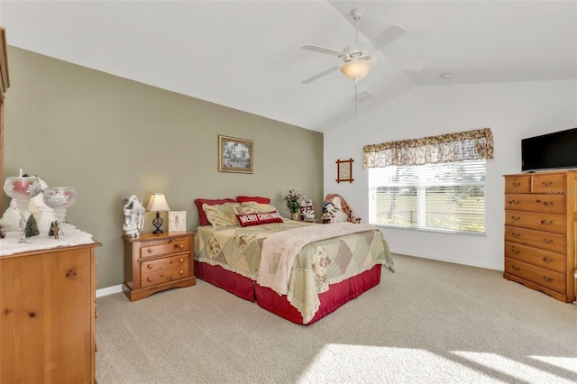 bedroom featuring ceiling fan, light colored carpet, and lofted ceiling