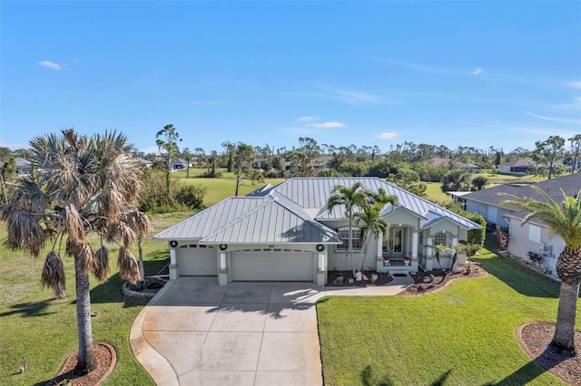 view of front of home featuring a garage and a front yard