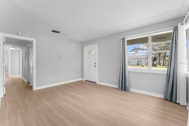 unfurnished room featuring light hardwood / wood-style flooring