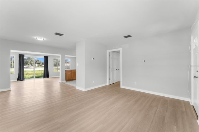 unfurnished room with light wood-type flooring