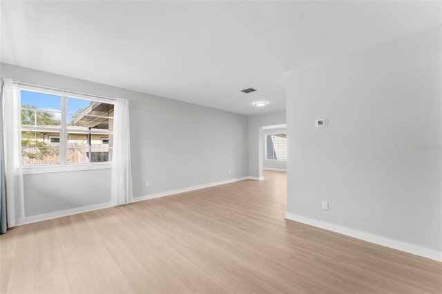 spare room with light hardwood / wood-style flooring