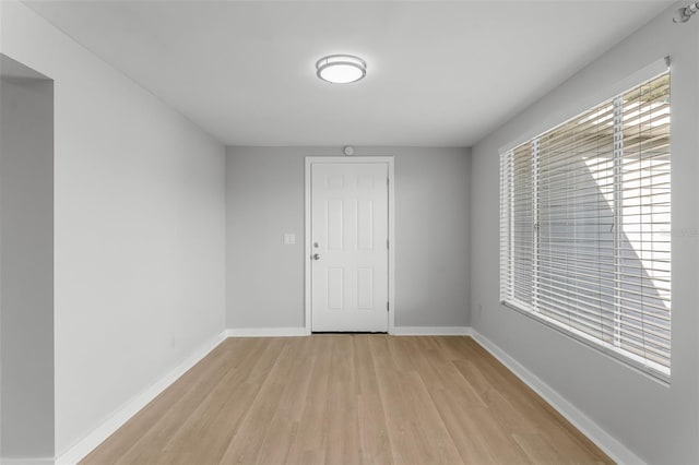 empty room with light wood-type flooring