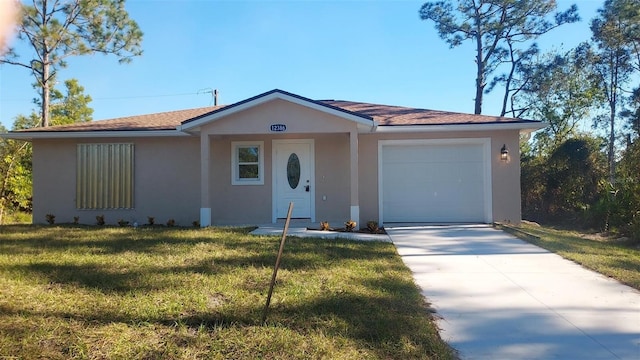 ranch-style home with a front lawn and a garage