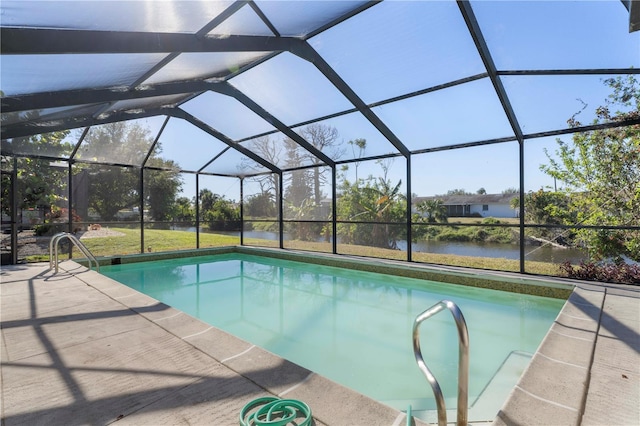 view of swimming pool with a lanai, a patio area, and a water view