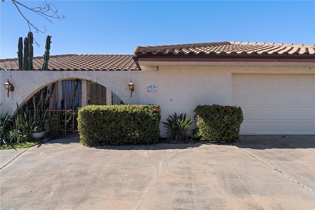 view of side of property featuring a garage