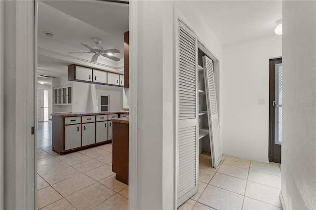 hallway featuring light tile patterned floors