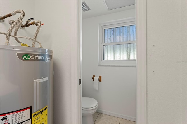 bathroom featuring tile patterned floors, water heater, and toilet