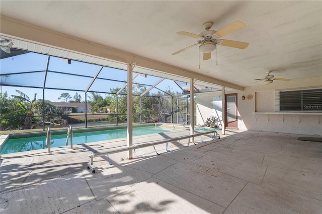 view of swimming pool with a lanai, a patio area, and ceiling fan