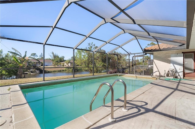 view of pool featuring a lanai, a patio area, and a water view