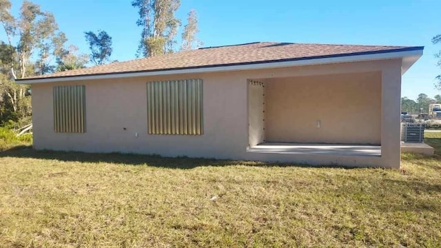 view of side of home featuring a lawn