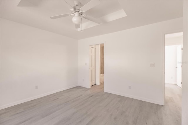 unfurnished room with ceiling fan and light hardwood / wood-style floors