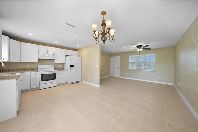 kitchen featuring sink, decorative light fixtures, white appliances, white cabinets, and ceiling fan with notable chandelier