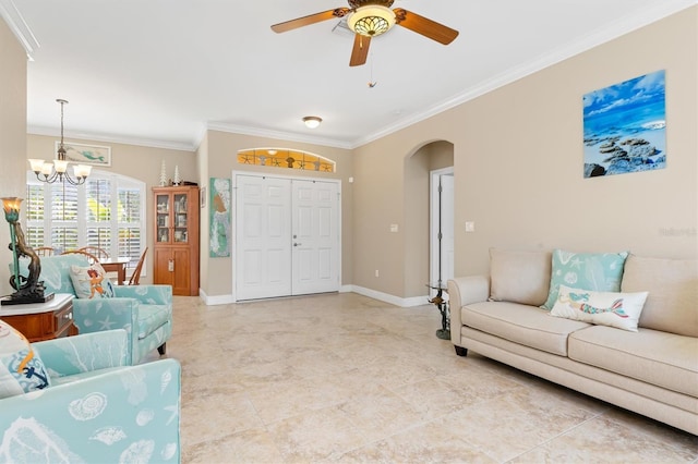 living room with ceiling fan with notable chandelier, light tile patterned floors, and crown molding