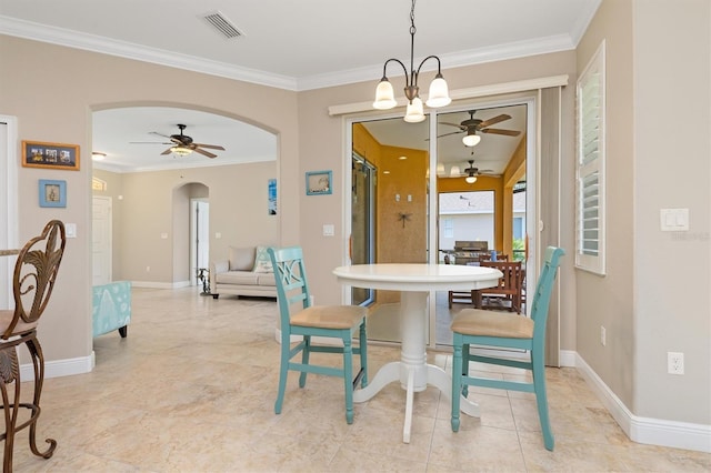 dining area featuring ceiling fan with notable chandelier and crown molding