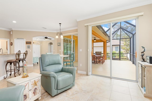 sitting room with ornamental molding, sink, a notable chandelier, and light tile patterned flooring