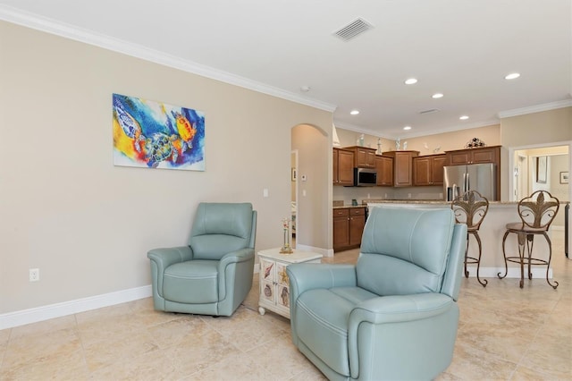 living room featuring light tile patterned floors and crown molding