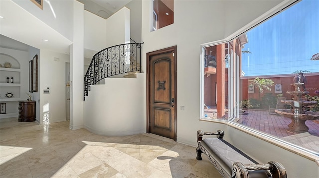 entryway with a high ceiling