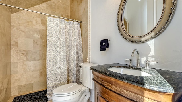 bathroom with a shower with shower curtain, vanity, and toilet