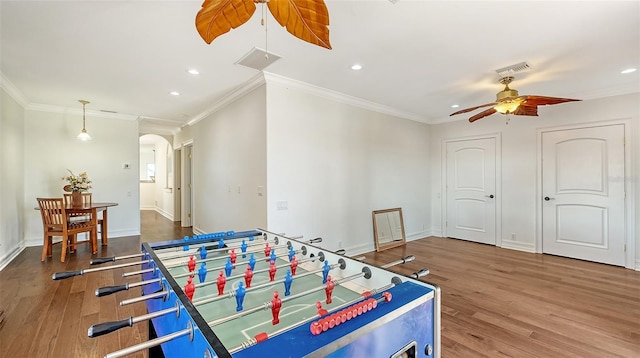 playroom featuring wood-type flooring, ceiling fan, and ornamental molding