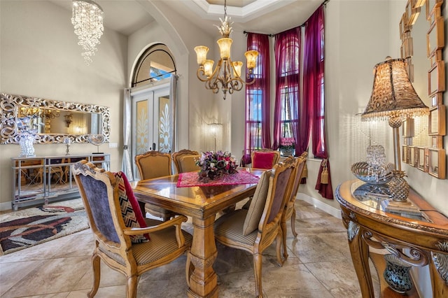 dining room with french doors and a chandelier