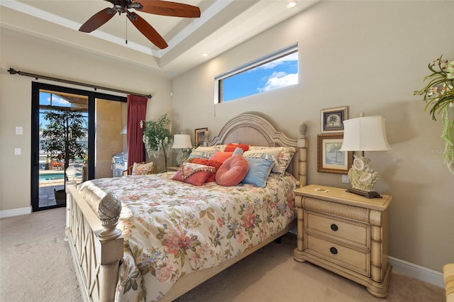 carpeted bedroom featuring ceiling fan, access to outside, and multiple windows