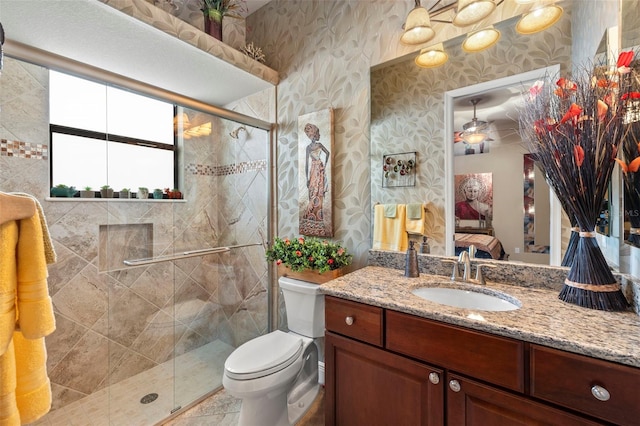 bathroom with vanity, toilet, and walk in shower