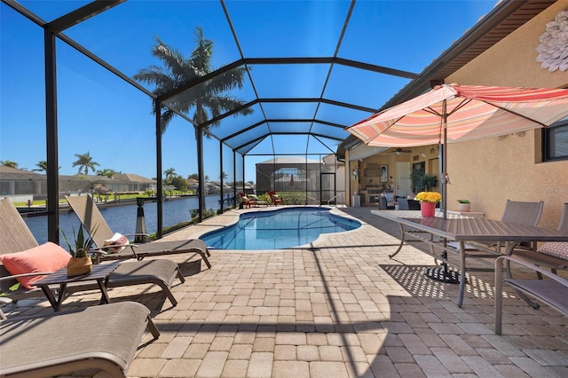 view of swimming pool with a lanai, a water view, a patio, and a boat dock