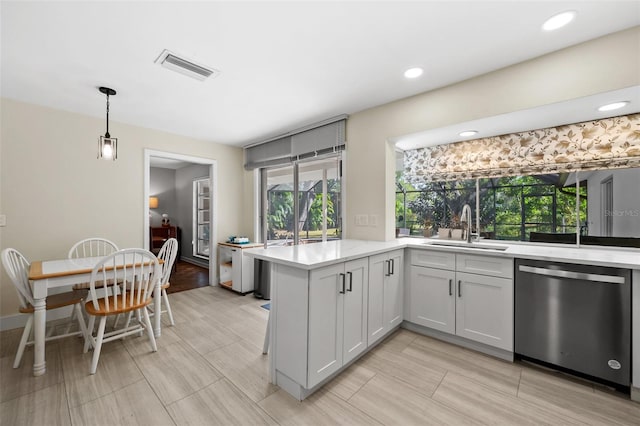 kitchen with white cabinets, dishwasher, plenty of natural light, and sink