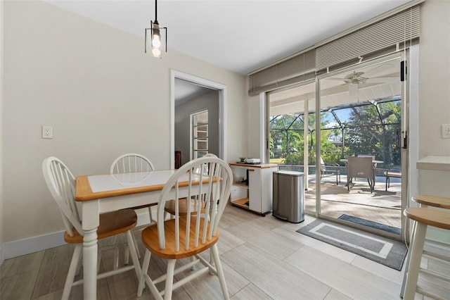 dining space featuring ceiling fan