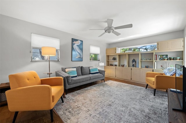 living room with hardwood / wood-style flooring and ceiling fan