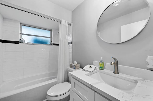 full bathroom featuring vanity, shower / bath combination with curtain, and toilet