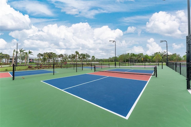 view of tennis court featuring basketball court