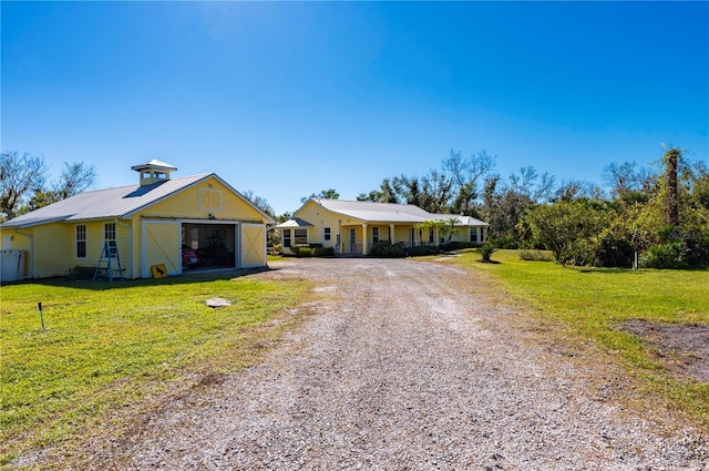 ranch-style home with a front yard and a garage