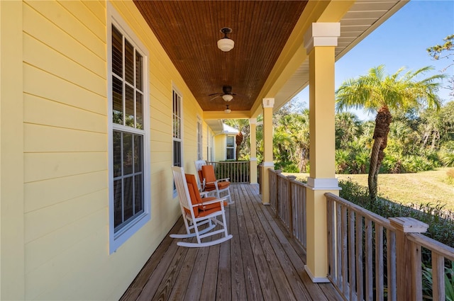 wooden deck featuring ceiling fan and covered porch