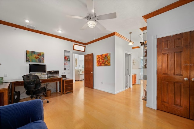 home office with ceiling fan, ornamental molding, and light wood-type flooring