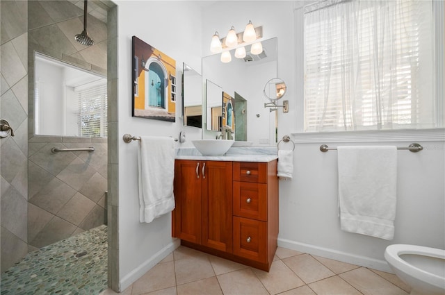 bathroom featuring tile patterned floors, vanity, tiled shower, and a bidet