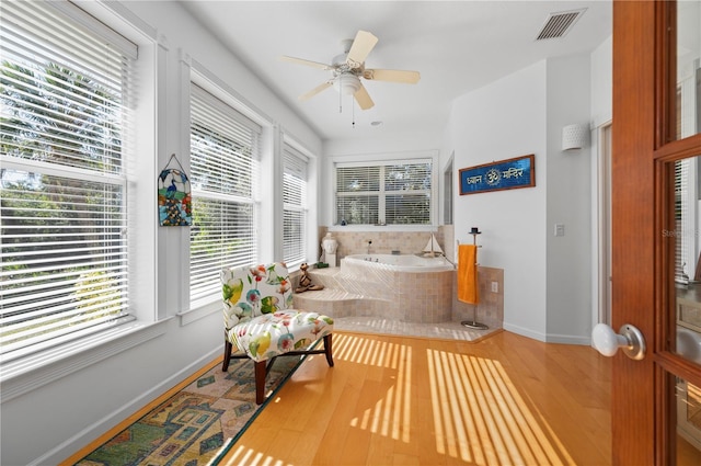 interior space featuring ceiling fan and hardwood / wood-style flooring