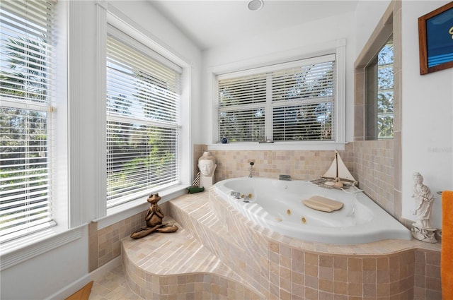 bathroom with tiled bath