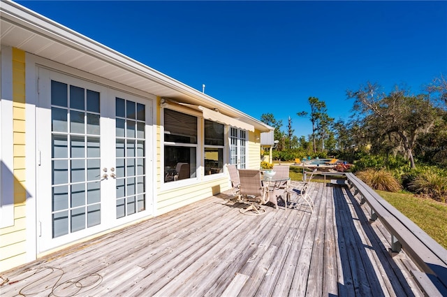 wooden deck featuring french doors