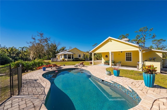 view of swimming pool featuring a patio area