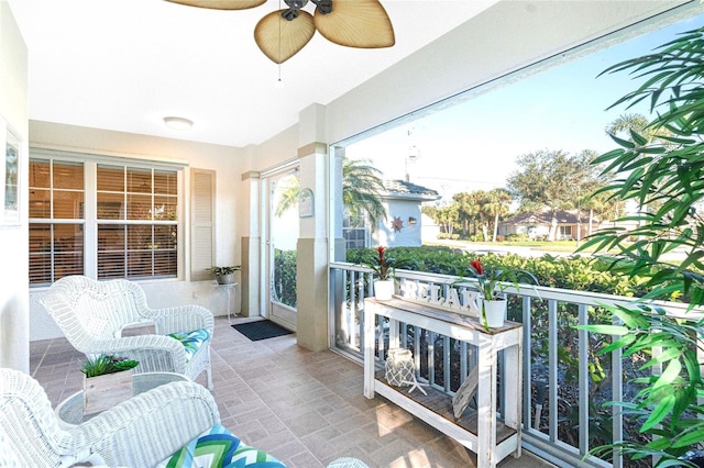 sunroom / solarium with ceiling fan