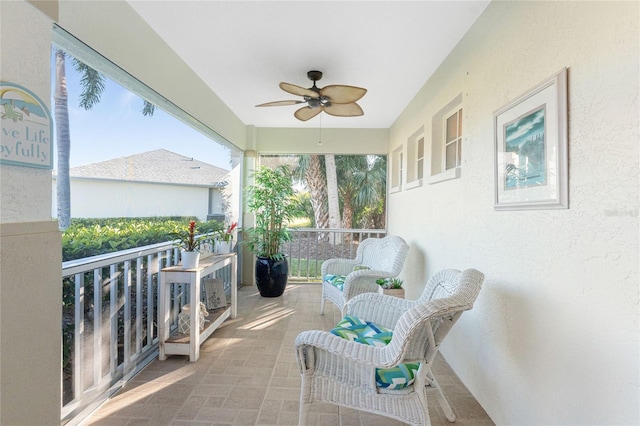 sunroom / solarium with ceiling fan