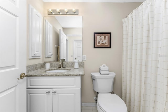 bathroom featuring vanity, toilet, and curtained shower